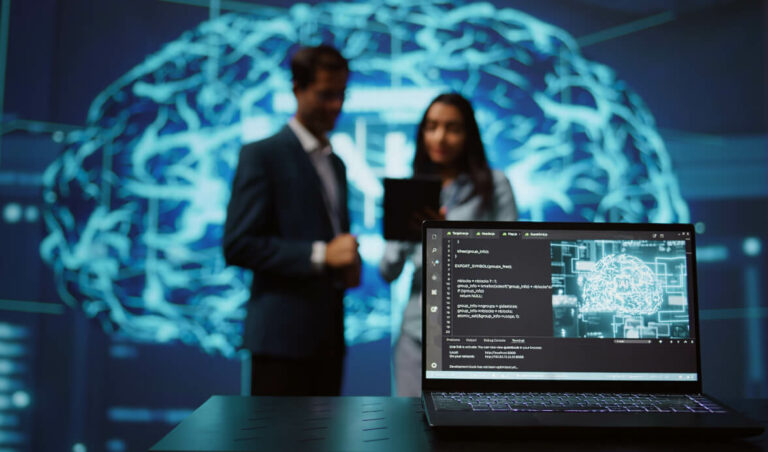 A laptop displaying code and a digital brain graphic in the foreground, with two professionals discussing in the blurred background, set against a backdrop of abstract technology visuals.